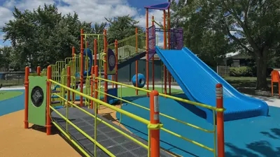 Co-An park playground equipment with a giant slide and climbing structure
