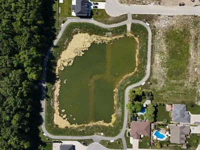 Aerial park view showing trail around water