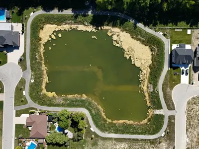 Aerial park image showing trail around water in pond