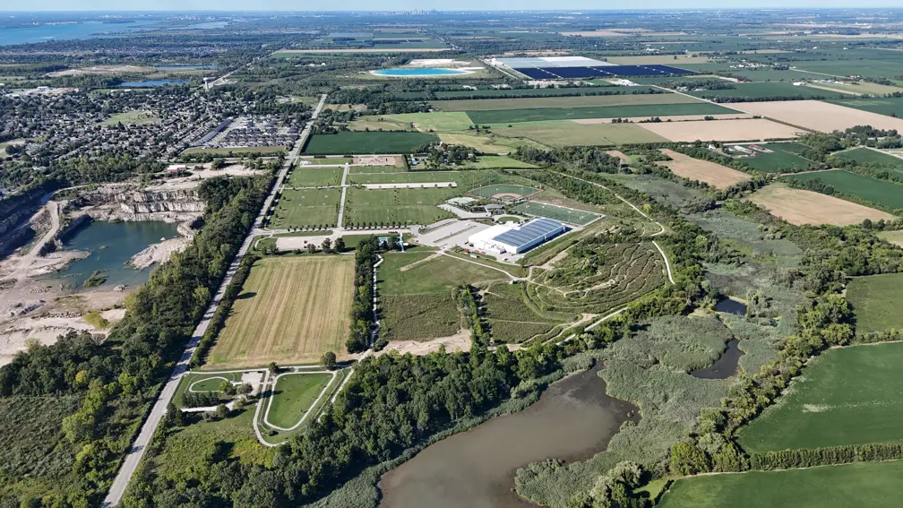 Aerial image showing both dog parks, green fields, trail,  WEBC bike trails, Libro Credit Union Recreation complex and soccer fields in the distance.