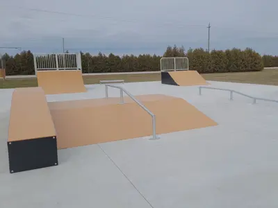 Full view of the skate park with Meloche Road in the background