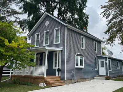 Image of dwelling located at 299 Bathurst Street, an example of a Vernacular style of building, constructed circa 1880