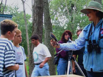 Bird being shown to visitors by a Holiday Beach worker