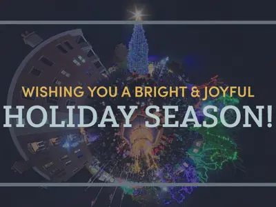 Wishing you a bright and joyful holiday season with an image of the municipal tree in the background