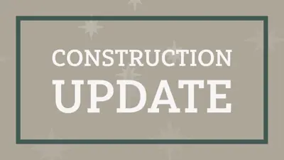 The words Construction Update surrounded by a green frame and beige background