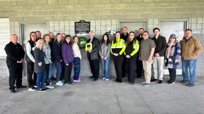 Members of Council, EMS, Fire and the community pose for a photo with the new Automated External Defibrillator located at the Libro Centre