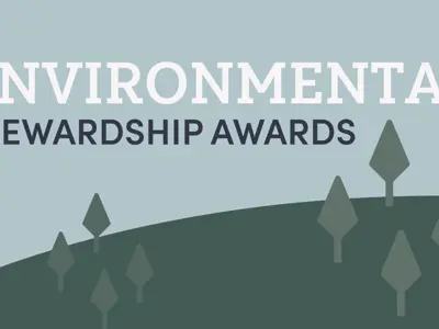 Environmental Stewardship Awards with green trees surrounding the words