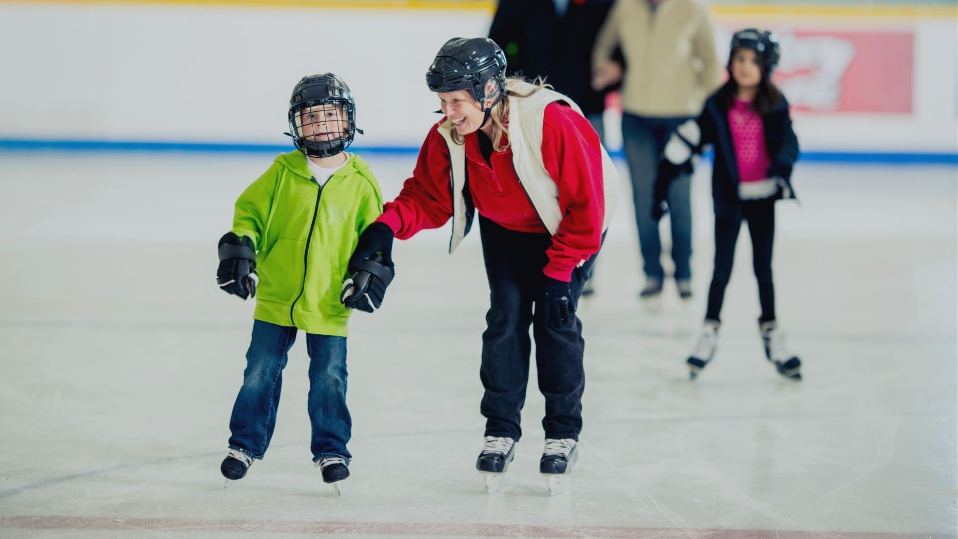 Two people skating on ice